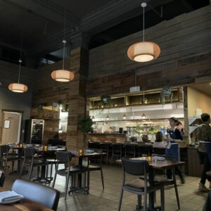 Modern upholstered chair with walnut frame