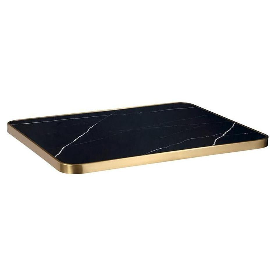 Tabletop in black sintered stone with a thickness of 2.9 cm and a golden edge