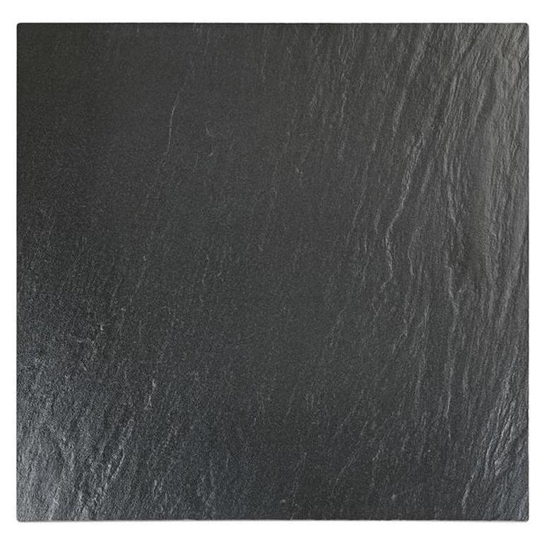 Tabletop made of black sintered stone with wavy textured surface, 2.2 cm thick.