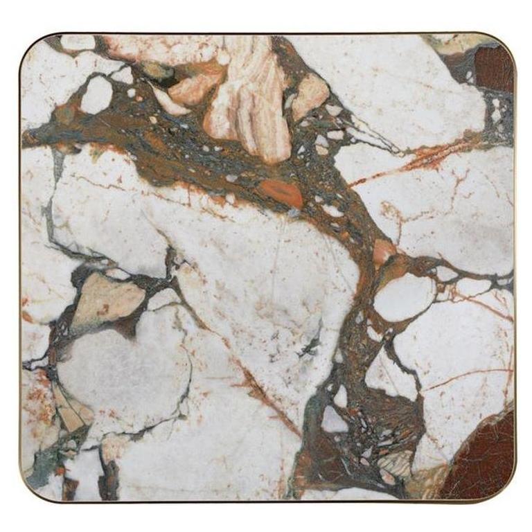 Tabletop in marbled multicolored sintered stone with a thickness of 2.9 cm and bronze edge.