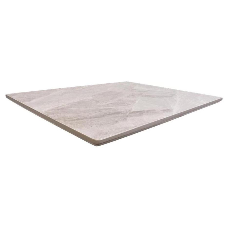 Tabletop in light gray shiny sintered stone pattern