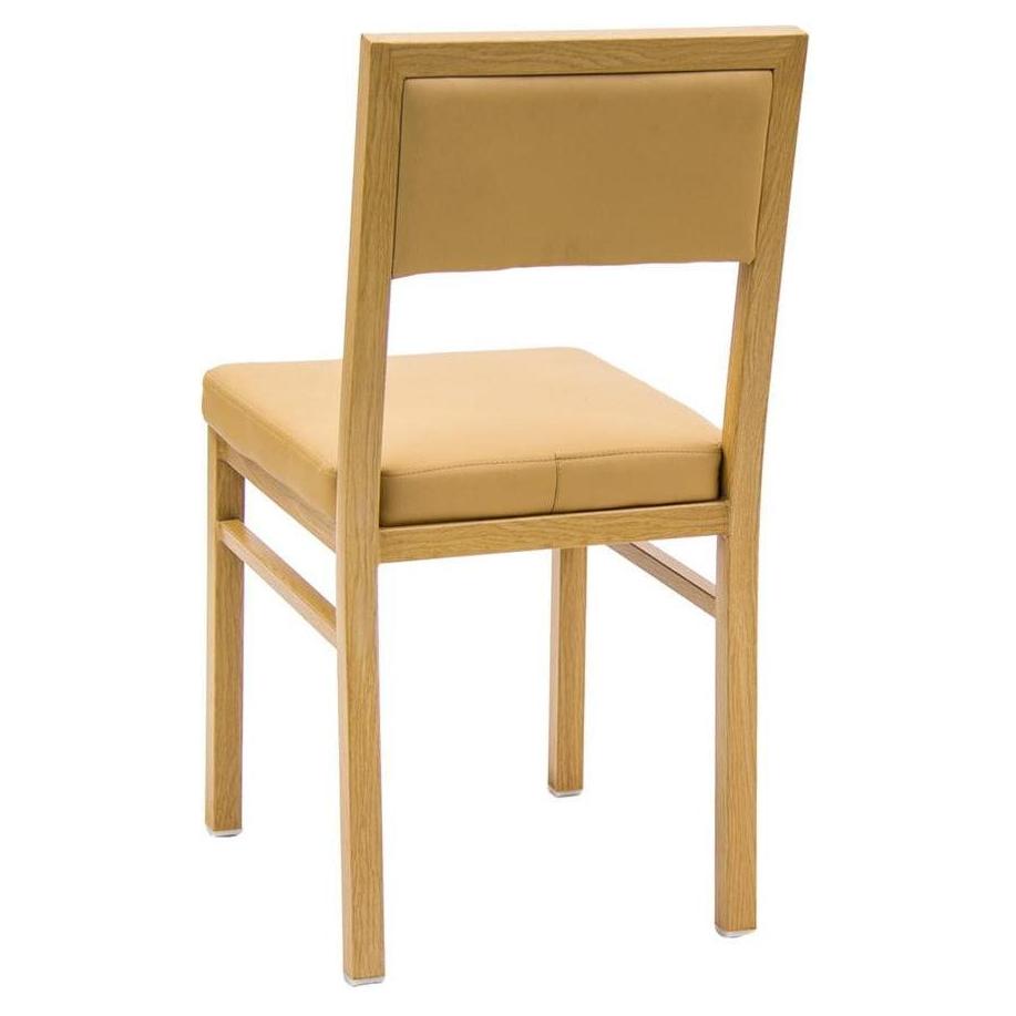 Indoor metal chair with natural finish and vinyl seat and backrest